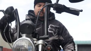 Photo of man sitting on a motorbike