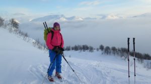 Photo of me wearing skis standing on a mountain